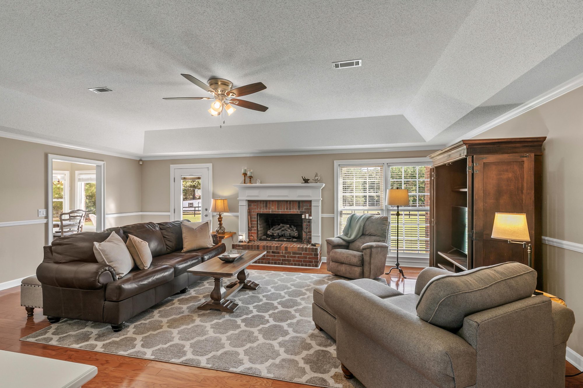 Living room with brick fireplace