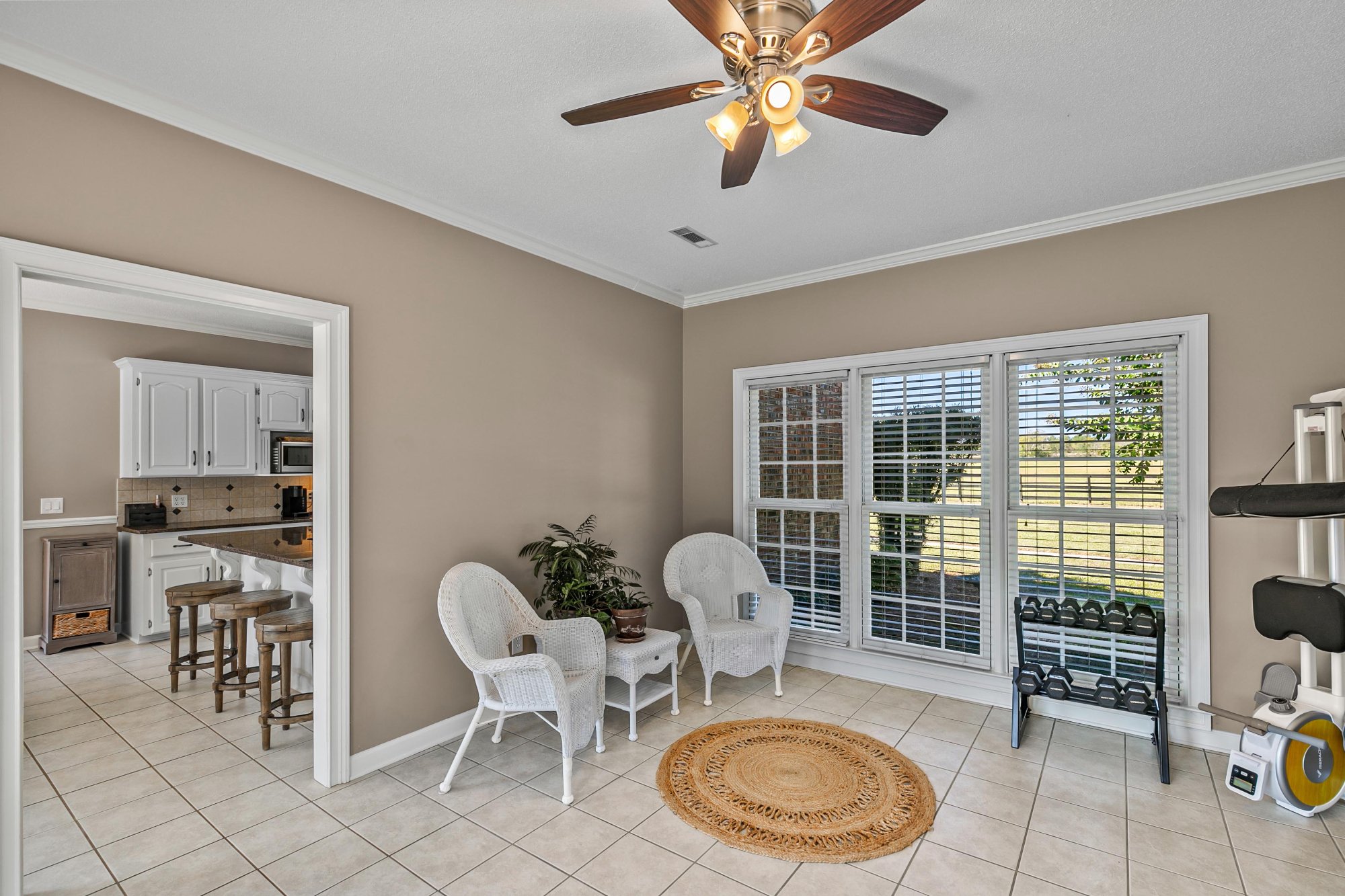 Sunroom with views of the property